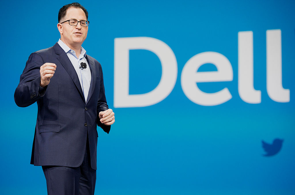 Michael Dell, founder and chief executive officer of Dell Inc., speaks during the 2015 Dell World Conference in Austin, Texas, U.S., on Wednesday, Oct. 21, 2015. Dell said trimming debt for the massive deal to combine his namesake company with EMC Corp. should progress relatively quickly in the next couple of years. Photographer: Matthew Busch/Bloomberg via Getty Images