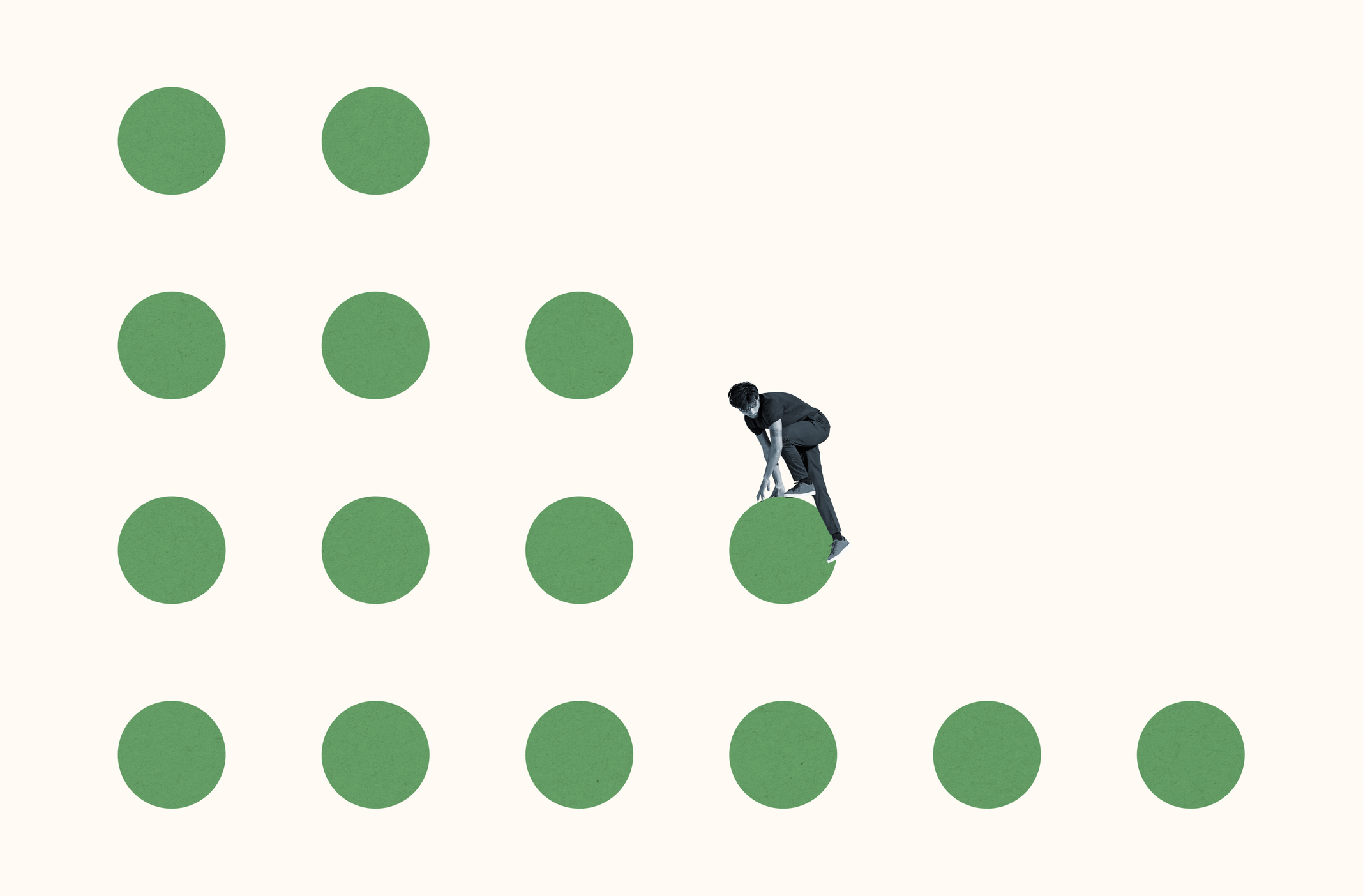 Full length of young courageous man climbing on green circles against white background