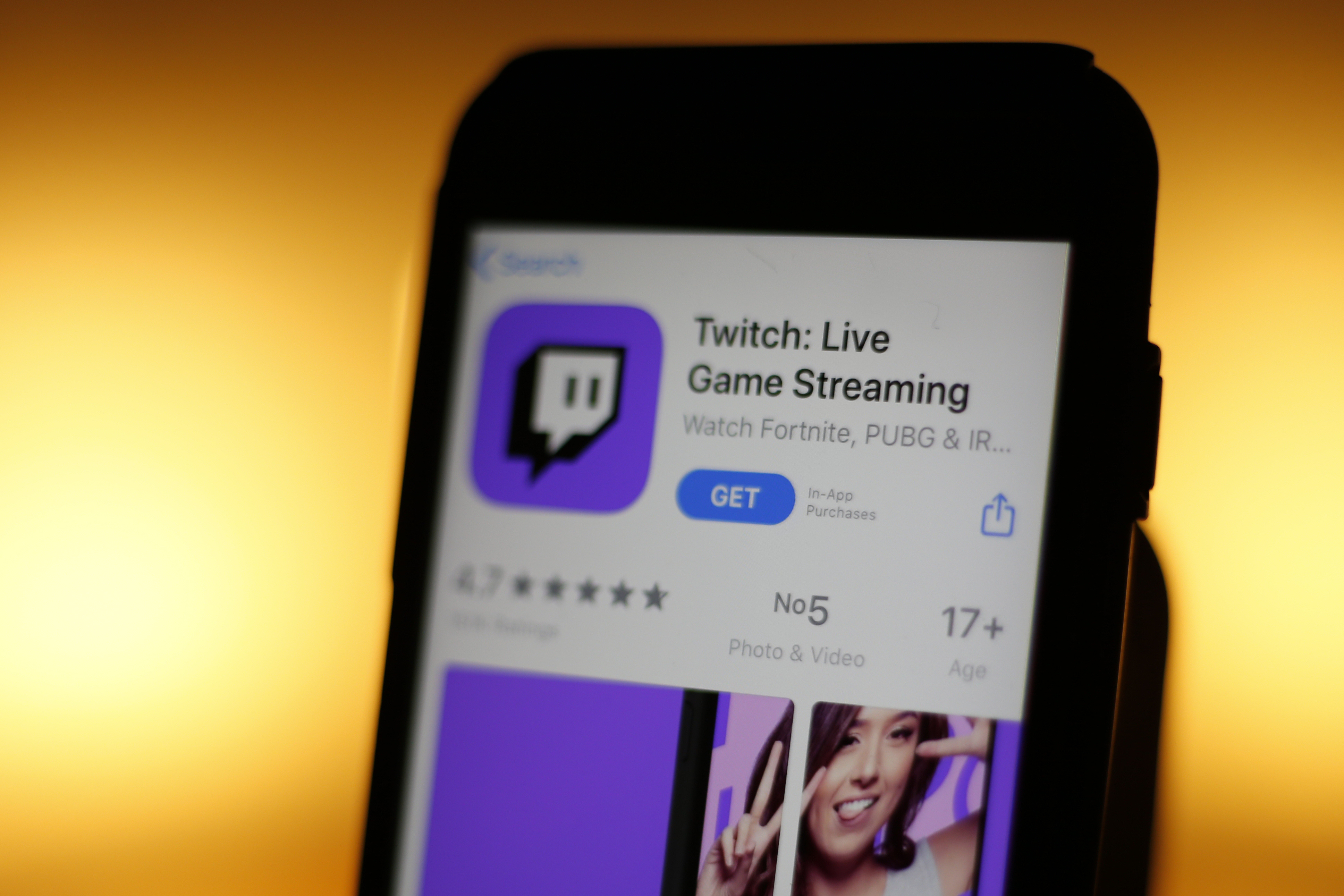 Image of a smartphone displaying the Apple Inc. App Store page for the Twitch streaming app.