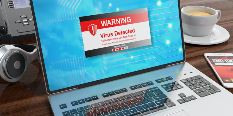 Stock photo of a virus alert on a laptop screen.