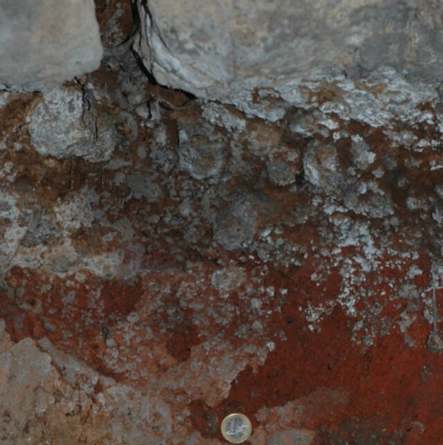 Lava overlying volcanic tephra in the substructure of the tomb.