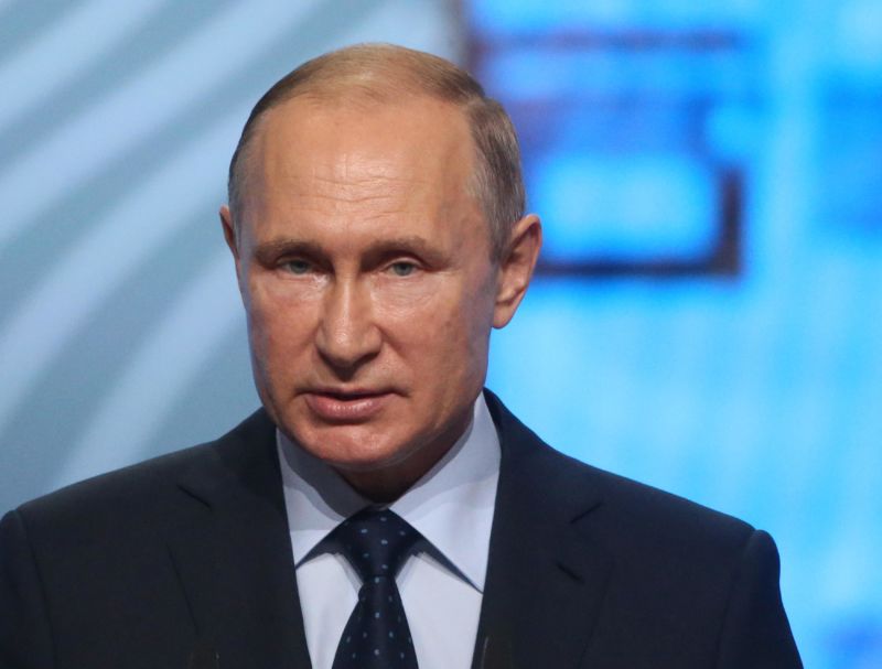 Russian President Vladimir Putin speaking at a forum.