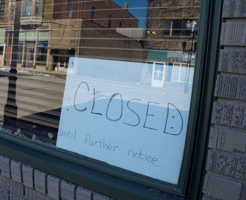 Sign in a windows reading: Closed until further notice
