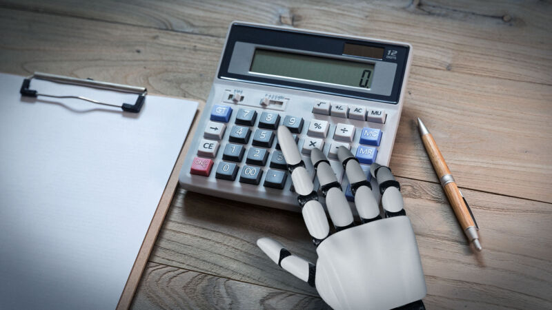 An artist's impression of a robot hand using a desktop calculator.