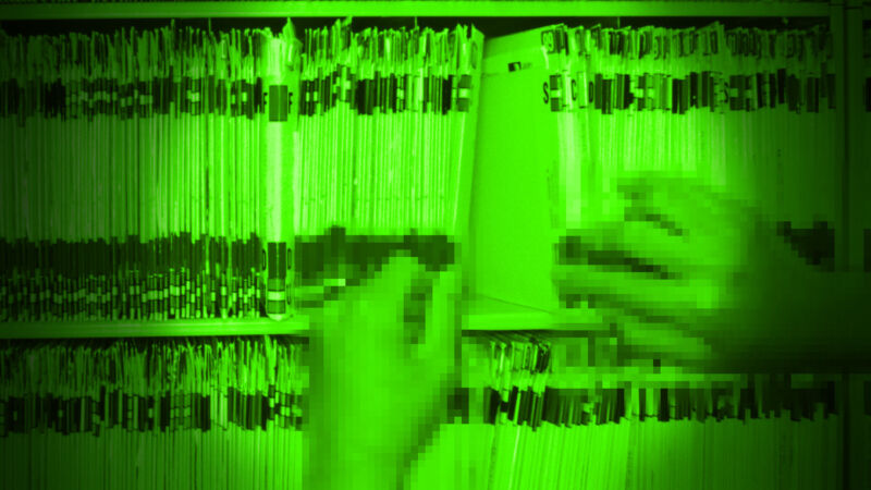 A pixelated green illustration of a pair of hands looking through file records.