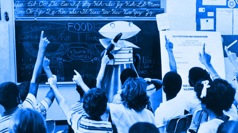 File photo of children in a classroom listening to a robot.